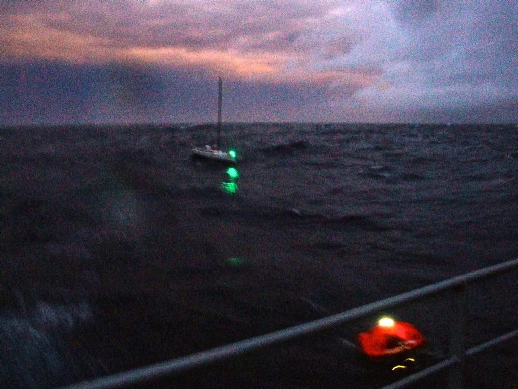 Liferaft nears ship in fading light © New Zealand Defence Force